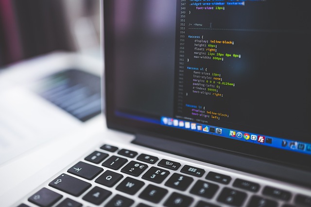 laptop with code editor and learning dashboard